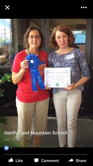 Mrs. Ott accepts award for club of the year. 